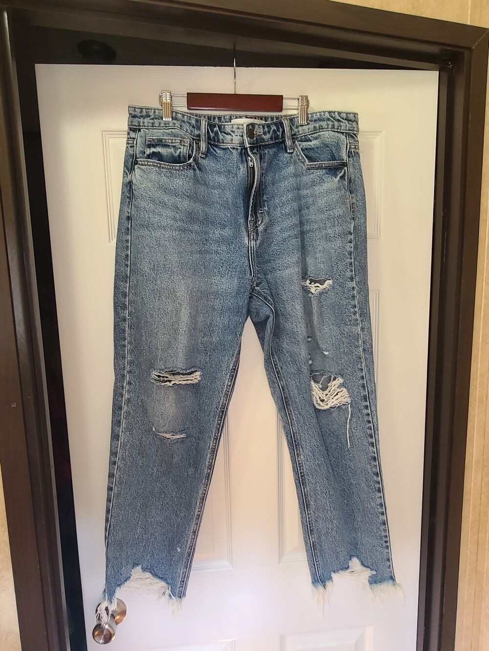 Hidden Jeans featuring a medium wash, heavy distressing